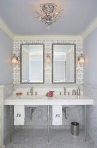 Suzie: Mahogany Builders - Glam bathroom with walls & ceiling painted blue, marble top 3-leg ...